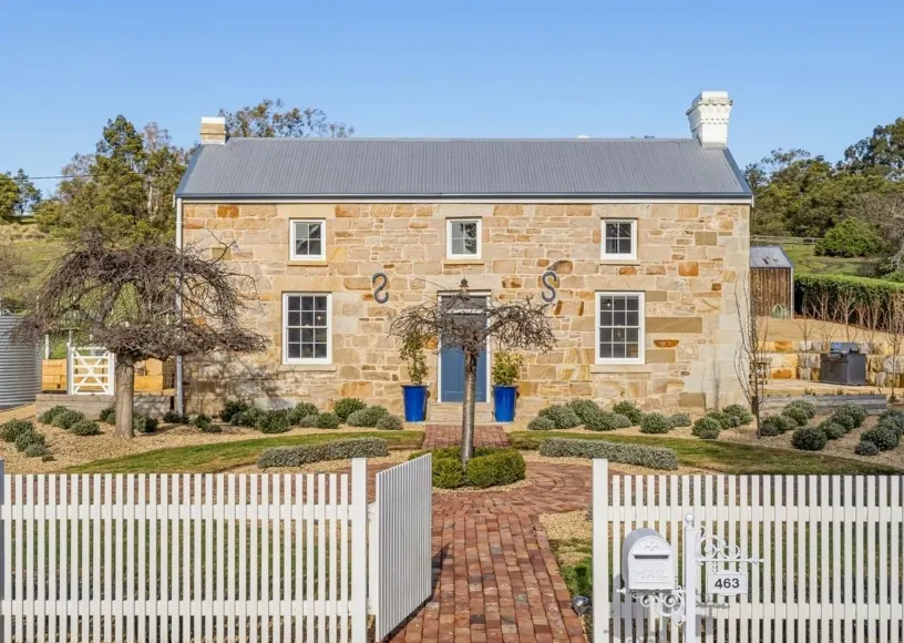 Sandstone residence with a picket fence in Pontville, Tasmania